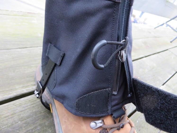 An easy zip paired with Velcrow to attach them, with a handy lace hook to keep them down.